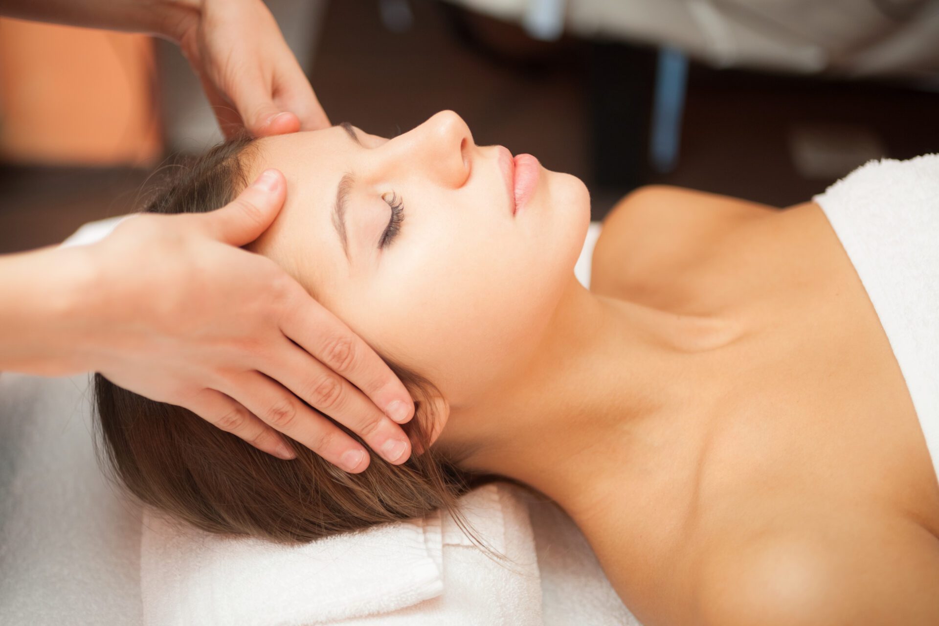 Woman having a facial massage Beautiful woman having a facial massage